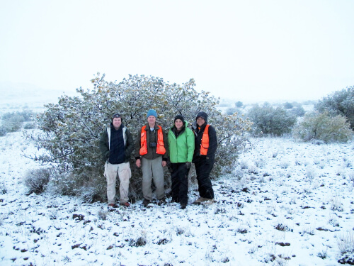 Field staff in a snow storm on Mauna Kea, 2011. Left to right: Chris Farmer, ABC; Paul Banko-USGS; Cheyanne Rapoza-MKFRP; and Ku'ulei Vickery-MKFRP. Photo by Robert Stevens