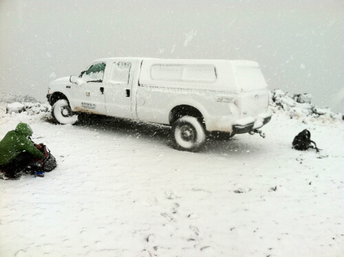 Hawai'i's not all white sands and beaches. This snow-covered truck awaited our freezing field crew on Mauna Kea. Photo by Robert Stevens