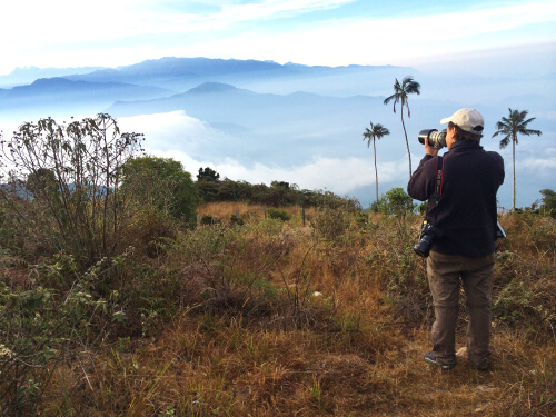 Jorge Brocca enjoys the view at Colombia's El Dorado Reserve. Photo by Benjamin Skolnik