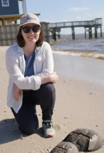 Annie Chester headshot taken on DE Bay with horseshoe crabs