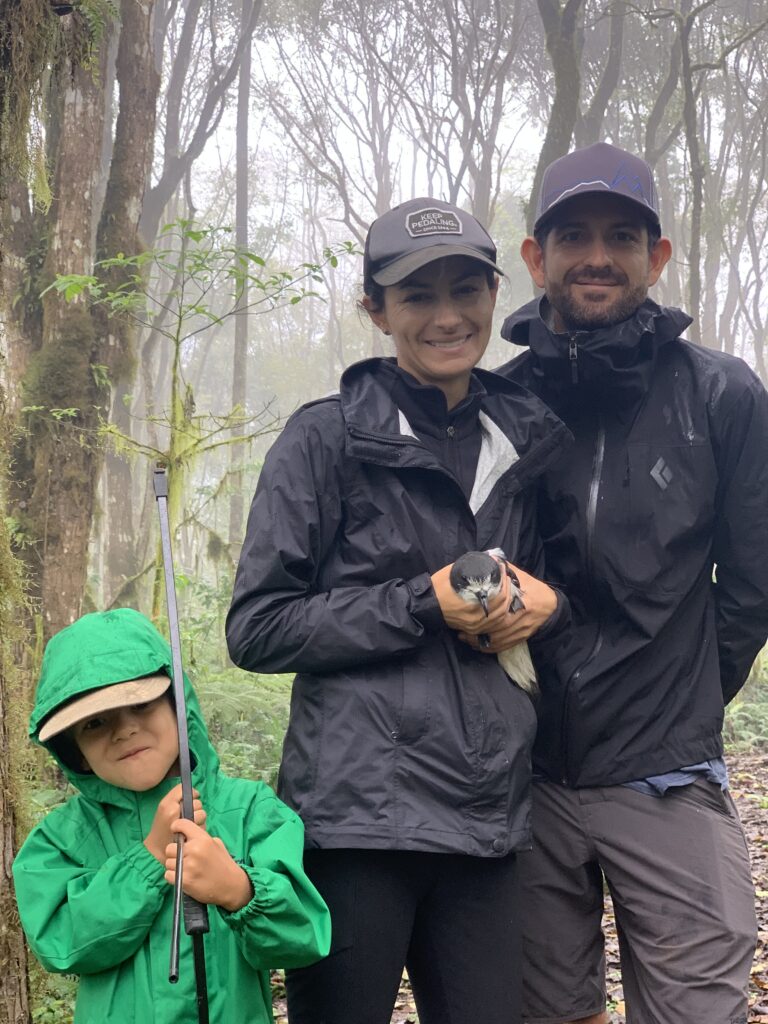 Carolina Proaño and Sebastián Cruz, a researcher with American Bird Conservancy, with a Galápagos Petrel. They are working to conserve the seabirds that nest only in the highlands of the Galápagos Islands. Both are trained and licensed to handle birds. Photo courtesy of Sebastián Cruz.