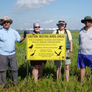 Gulf Coast Partners: ABC collaborators, Gulf Coast Bird Observatory (GCBO) and Audubon Texas in Galveston Bay posting signs for nesting birds. Pictured left to right: Felipe Chavez (GCBO), Amanda Hackney (Audubon), Susan Heath (GCBO), and Edgar Lopez, student.